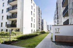 a building with the number on it next to a sidewalk at Good Time Apartments Kościelna 17 19 in Poznań