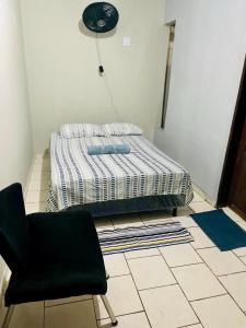 Postel nebo postele na pokoji v ubytování Casa Vidal - COP 30 - Centro de Belém + 2 fotografie