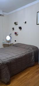 Un pat sau paturi într-o cameră la Davini Home & Relax