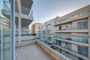 a view from the balcony of an apartment building at Ortigia Penthouse, Private Terrace, Distant Sea Views by Haven & Keys Malta in Tal-Għoqod