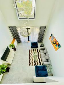 a living room with two chairs and a couch at lalahouse6 in Khu Chi Lăng