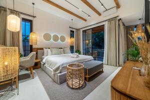 a bedroom with a bed and a balcony at Cascade 5 - Tropical 1BR Hideaway with Garden View in Ubud in Ubud