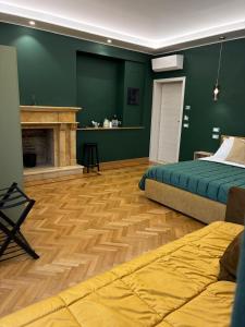 a bedroom with a bed and a fireplace at Il giardino di Silvia in Isernia