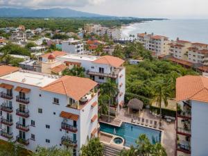 an aerial view of a city with buildings and the ocean at Gorgeous Penthouse across from Beach with Ocean Views! in Punta Mita