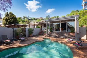 a swimming pool in the backyard of a house at House Falcon in Pretoria
