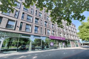 a large brick building on a city street at Premier Inn Hannover City University in Hannover