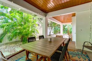 a dining room with a wooden table and chairs at Walk to Wabasso Beach Home with Hot Tub and Bikes in Sebastian