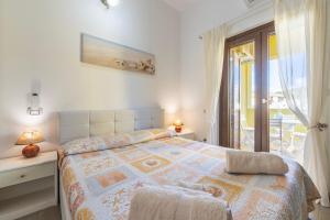 Postel nebo postele na pokoji v ubytování Villa Veronica Villasimius + 57 fotografií