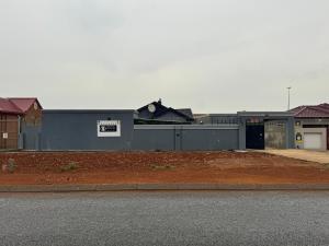 a building on the side of a street at Tseleng Guest House in Vosloorus