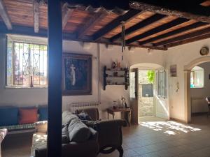 a living room with a couch and a table at Painter's House Historic Stone Villa with Sea View in Perast +33 photos