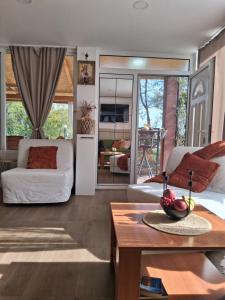 a living room with a bed and a table at Drinski kej in Zvornik