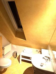 Koupelna v ubytování Bohn-Ferienwohnungen + 29 fotografií