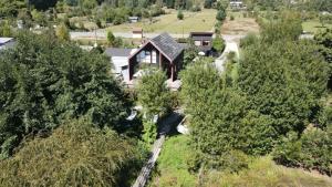an aerial view of a house with trees at Tiny house río Calle Calle in Valdivia