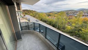 a balcony of a building with a view of a road at Мотел Ханай 
