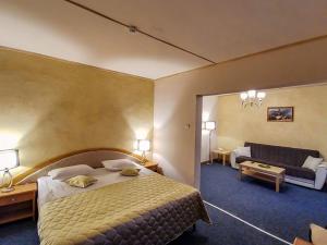 Ένα ή περισσότερα κρεβάτια σε δωμάτιο στο Hotel Belvedere