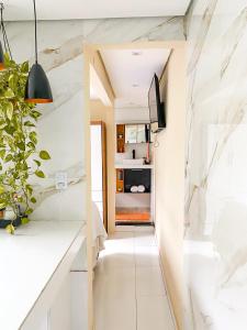 TV a/nebo společenská místnost v ubytování Loft Lumiere Vila do Abraão Ilha Grande