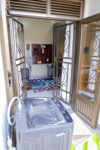 a view of a room with a tub in a hallway at Luxury Gem in Nsambya 1km from American Embassy in Kampala +43 photos