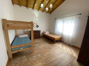 a bedroom with two bunk beds and a window at Casa en Costa Del Este in Costa del Este