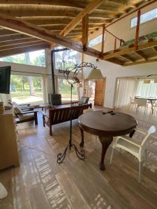 a living room with a table and a couch at Casa en Costa Del Este in Costa del Este