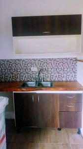 a kitchen with a sink and a counter top at Casa Valle Verde in Sierra de los Padres