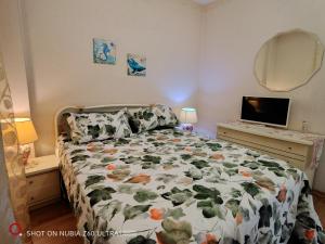 Giường trong phòng chung tại Atlantis Apartment Trieste
