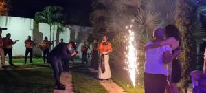 a group of people standing in front of a fountain with lights at Villa Cami in La Mata