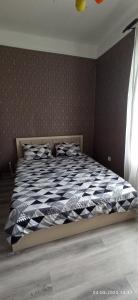 Postel nebo postele na pokoji v ubytování Центр города, Аг Шехер Бульвар