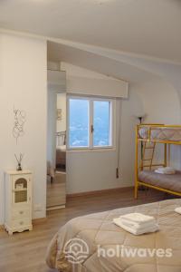 Ένα ή περισσότερα κρεβάτια σε δωμάτιο στο La casa di Luisa