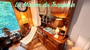 an overhead view of a room with a desk and a lamp at La maison du Trappeur et la cabane des sources in Le Mont-Dore