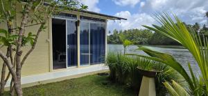a house with a view of the water at Feyola`s Leaf in Pelena