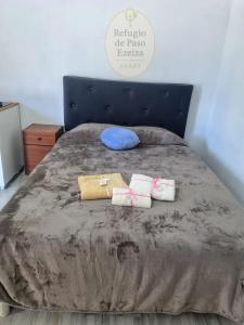 Ένα ή περισσότερα κρεβάτια σε δωμάτιο στο Refugio de Paso Ezeiza