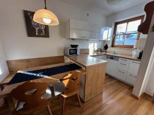 Η κουζίνα ή μικρή κουζίνα στο ChiemseeStrand +4 φωτογραφίες