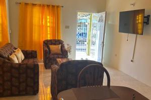 Coin salon dans l'établissement Bungalow in Falmouth, Jamaica