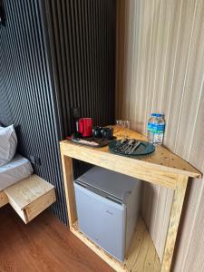 a wooden table with a plate on top of it at The Glamp - Homagama in Talagala