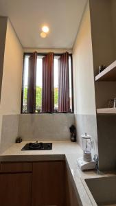 Kuchyň nebo kuchyňský kout v ubytování Puspa Private Guest House