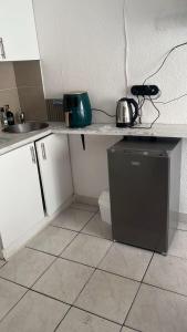 a kitchen with a counter with a sink and a dishwasher at 12 on lake in Parkwood +1 photo