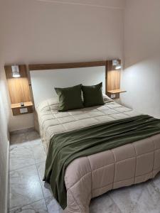 a bedroom with a large bed in a room at Continente Park in San Clemente del Tuyú