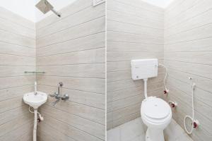 two pictures of a bathroom with a toilet and a sink at Hotel O Mandkaranya in Misrikh
