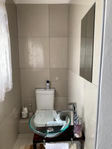 a bathroom with a sink and a toilet at Xintu Xa Hina Guesthouse in Nkowakowa