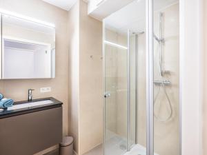 a bathroom with a shower and a sink at Seawhisper in Galopen +18 photos