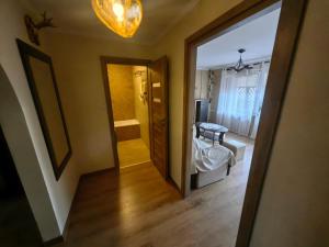 a room with a door leading to a bedroom at Zielony Balkon in Sanok