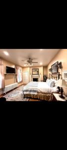 a bedroom with a bed and a ceiling fan at Langdon Hill House Felty Room in Gettysburg