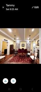 a living room with a couch and a table at Langdon Hill House Felty Room in Gettysburg +7 photos