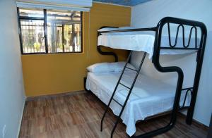 Ένα ή περισσότερα κρεβάτια σε δωμάτιο στο Casa Completa con parqueadero privado capacidad de hasta 8 personas