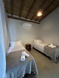 En eller flere senge i et værelse på Villa Bonita Residencial