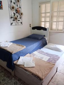 Ένα ή περισσότερα κρεβάτια σε δωμάτιο στο Casa de Alessandra