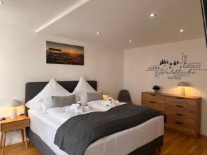 Ένα ή περισσότερα κρεβάτια σε δωμάτιο στο WINETIME - Apartment Sankt Martin für 2 Personen im Zentrum Luftkurort an der südlichen Weinstraße zwischen Neustadt und Landau