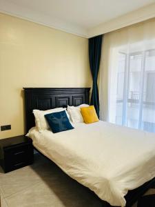 En eller flere senge i et værelse på Comfy Crib