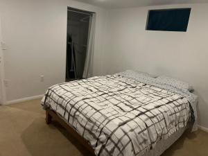 a bedroom with a bed in a white room at Hilltop Orchard Guest Suite with Scenic View in Yakima