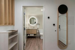 a bathroom with a sink and a mirror at TownePlace Suites by Marriott Hickory in Hickory